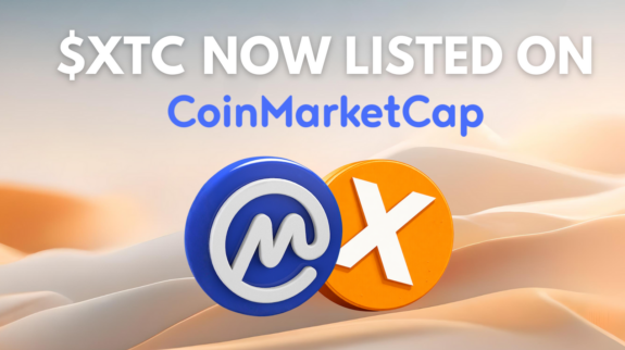 xitcoin-xtc-now-listed-on-coinmarketcap $XTC listed on CoinMarketCap with CoinMarketCap and Xitcoin logo over desert dunes.