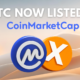 $XTC listed on CoinMarketCap with CoinMarketCap and Xitcoin logo over desert dunes.