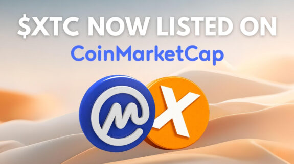 $XTC listed on CoinMarketCap with CoinMarketCap and Xitcoin logo over desert dunes.